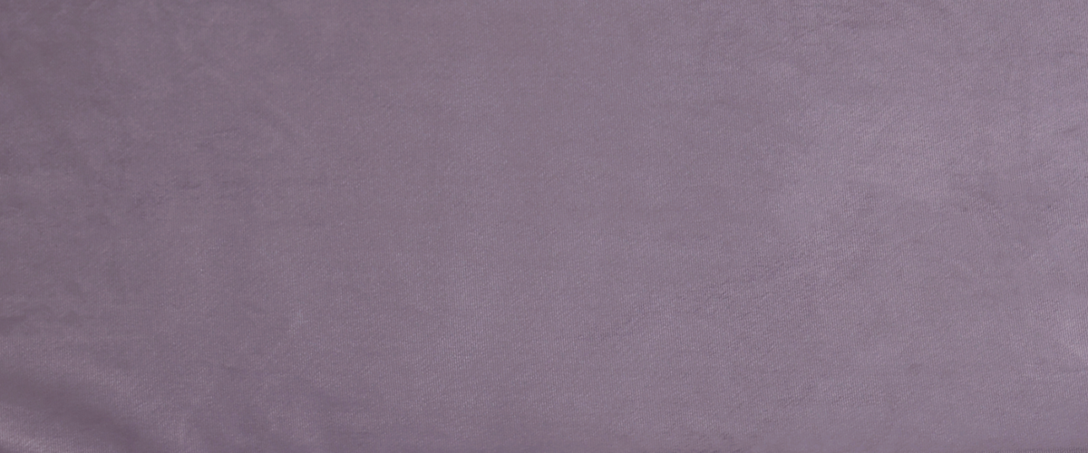 Fabric close up. A mauve purple shown in a darker light.