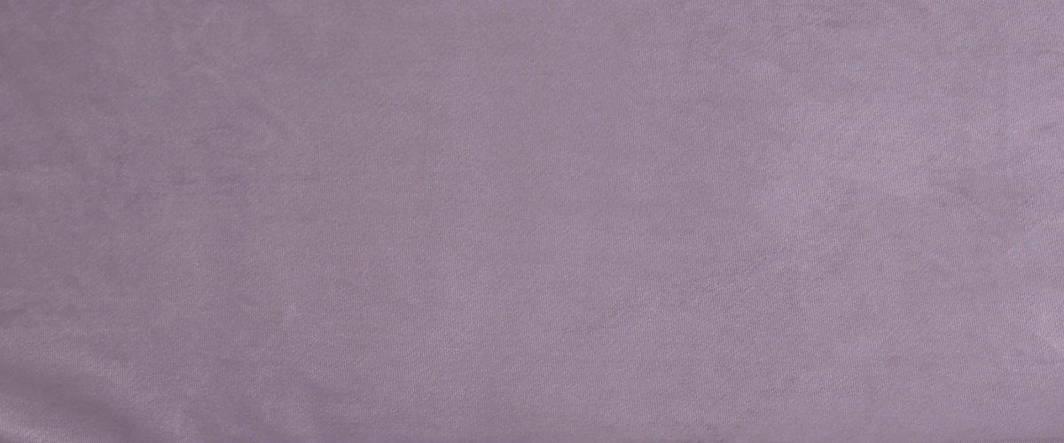 Fabric close up. A mauve purple shown in a brighter light.